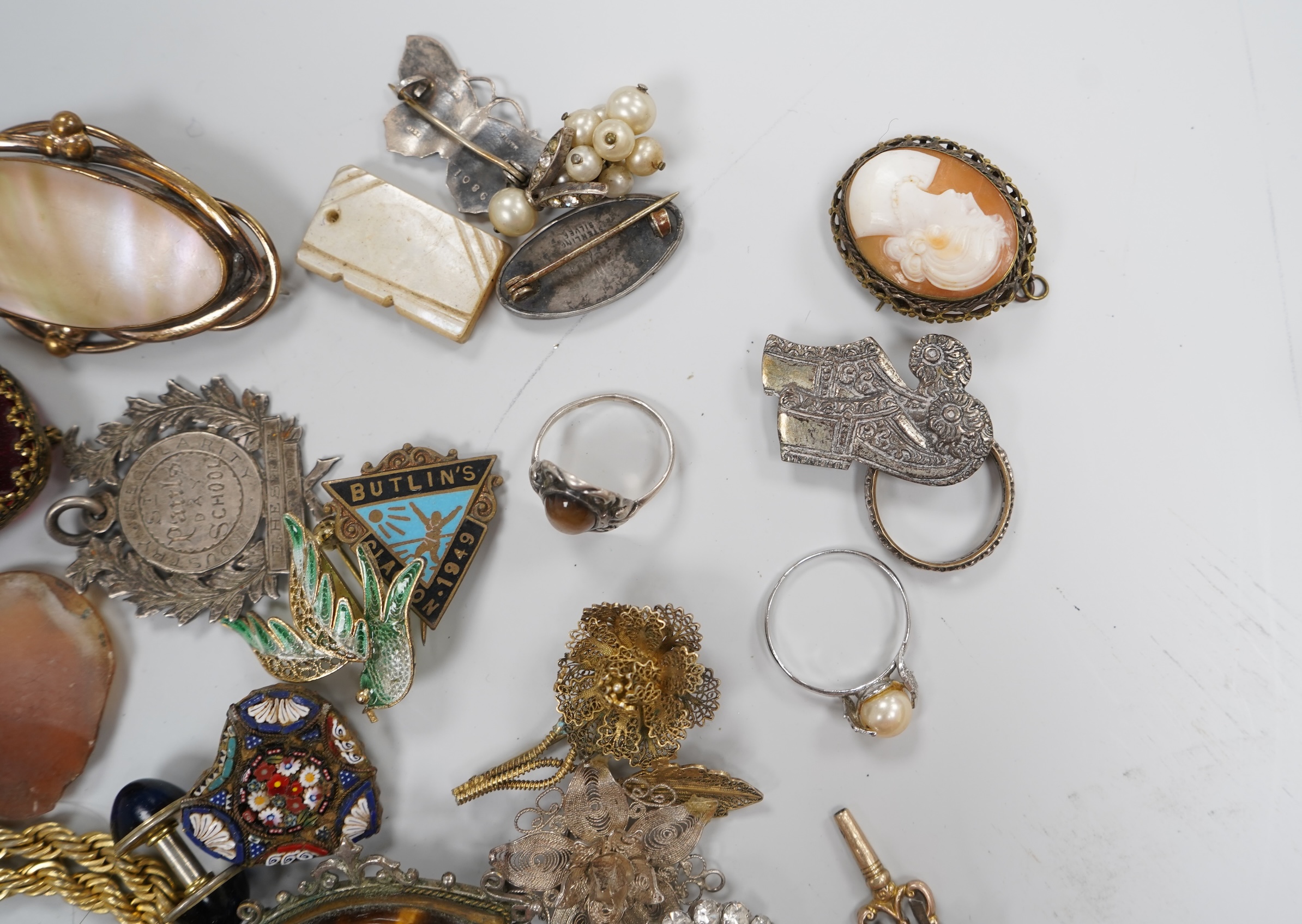 A group of costume jewellery and collector's items in a Japanese lacquer box